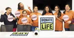 Pink Club Students with Donate Life Sign