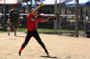 Young girl pitching softball