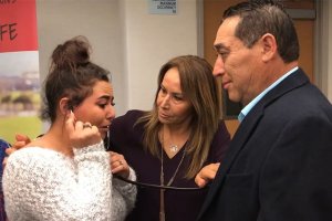 Erika Preciado of Ceres, CA listens to her father's heart beating inside of his recipient, Ramiro Cruz in April, 2019. Photo by The Modesto Bee